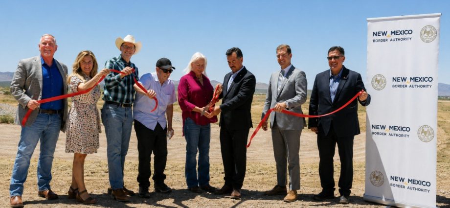 Alt Text: Officials participate in a ribbon-cutting ceremony celebrating completion of Phase 3 of the Southern New Mexico Berm Project in Columbus, New Mexico.