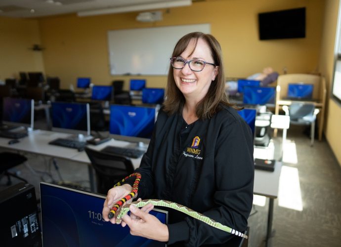 WNMU nursing instructor Joline Lowe demonstrates one of her interactive teaching methods after receiving the New Mexico Nursing Education Consortium Faculty Teaching Award for excellence in nursing education.