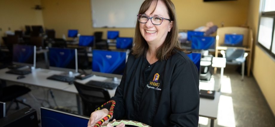 WNMU nursing instructor Joline Lowe demonstrates one of her interactive teaching methods after receiving the New Mexico Nursing Education Consortium Faculty Teaching Award for excellence in nursing education.
