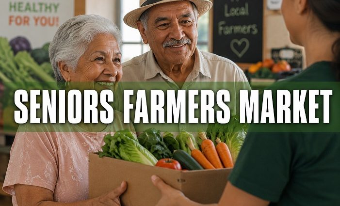 Older couple receiving a box filled with fresh vegetables at a farmers market.