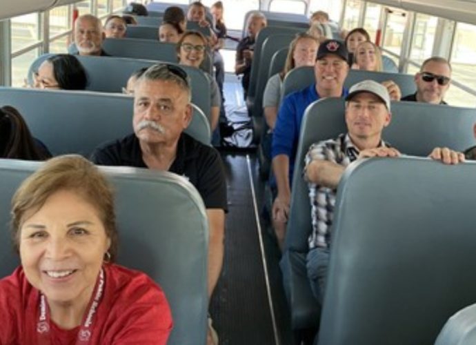 Deming Public Schools transportation employees, contracted bus drivers and safety personnel participate in S.T.A.R.T. training aboard a school bus.
