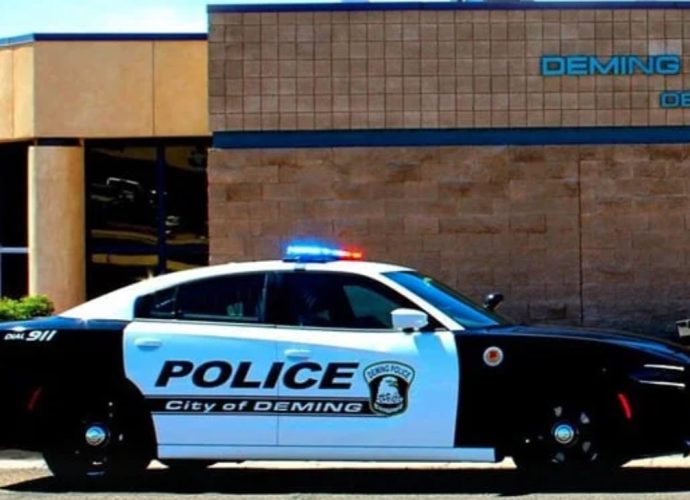 A Deming Police Department patrol vehicle outside the department building.