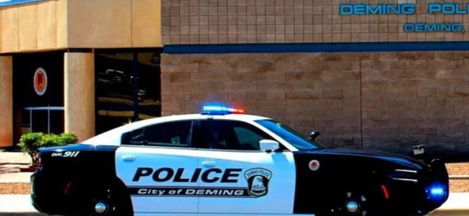 A Deming Police Department patrol vehicle outside the department building.