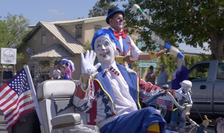 Clowns ride in the Great American Duck Race parade in downtown Deming during a previous year’s event.