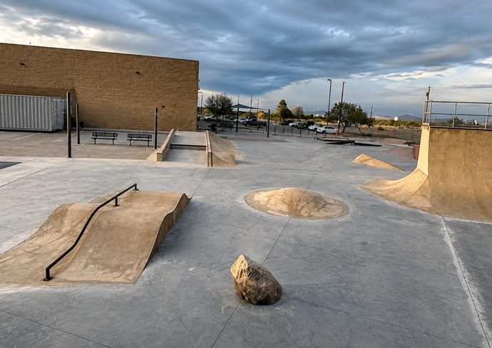 Starmax Skate Park in Deming, featuring concrete ramps, rails and skating obstacles.