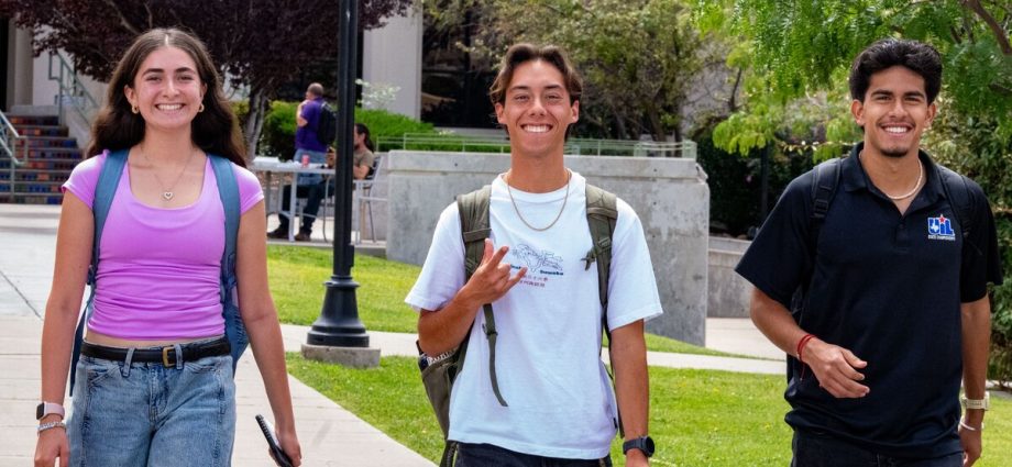 Three Western New Mexico University students walk across the Silver City campus during the first week of Fall 2026 classes.