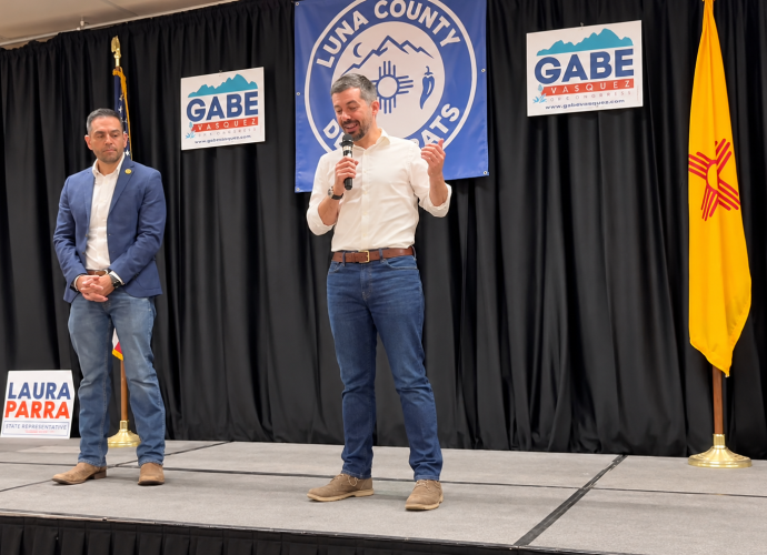 Pete Buttigieg speaks as U.S. Rep. Gabe Vasquez looks on during a campaign event at the Mimbres Valley Learning Center in Deming.