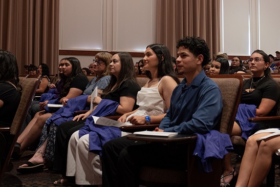 WNMU nursing students attend a purple coat ceremony on campus.